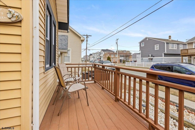 wooden deck with a residential view