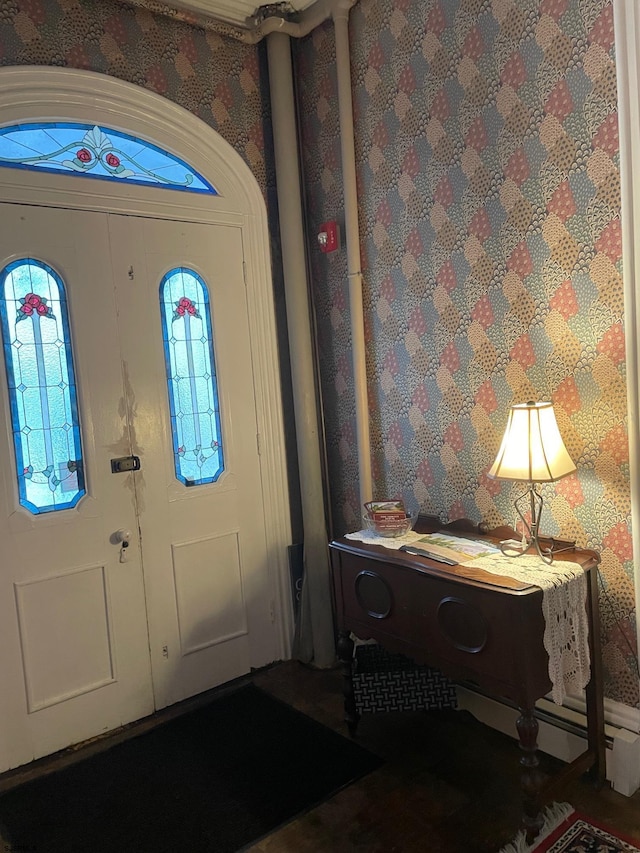 entryway featuring wallpapered walls