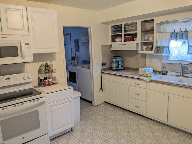 kitchen with light countertops, white cabinetry, a sink, white appliances, and under cabinet range hood