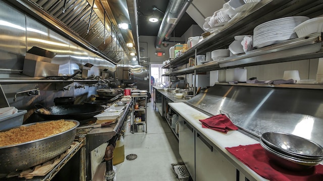 interior space featuring finished concrete flooring and open shelves