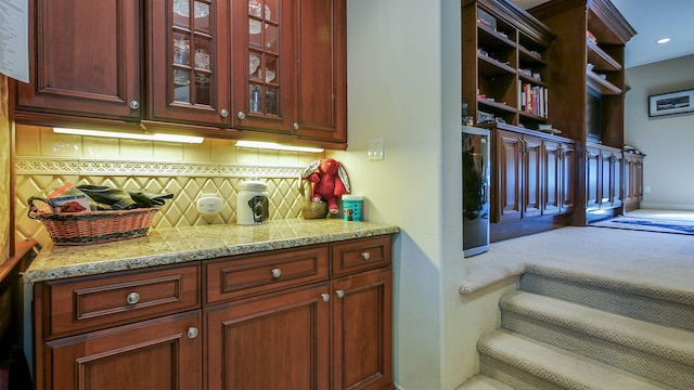 bar with tasteful backsplash, carpet flooring, and recessed lighting