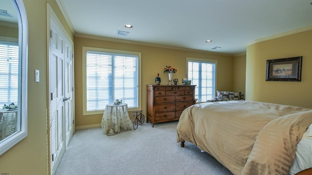 carpeted bedroom featuring baseboards, visible vents, crown molding, and recessed lighting