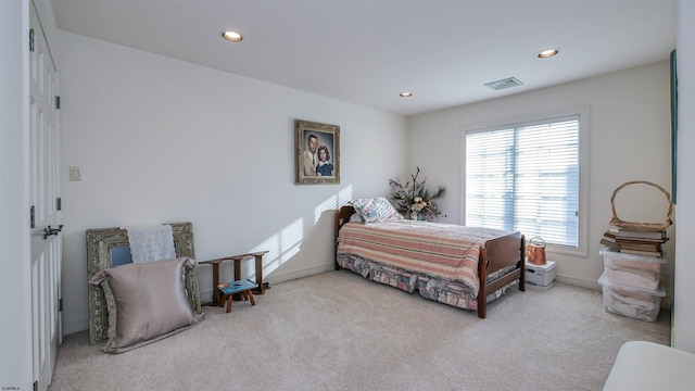 carpeted bedroom featuring baseboards, visible vents, and recessed lighting