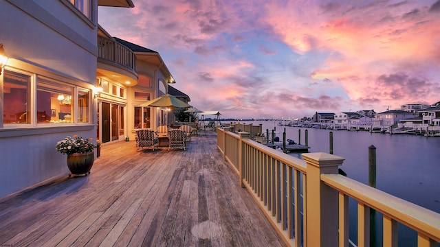 exterior space featuring a water view and a boat dock