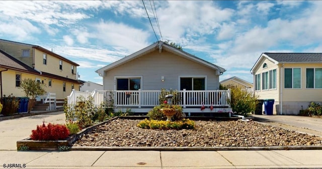 bungalow-style home featuring a deck