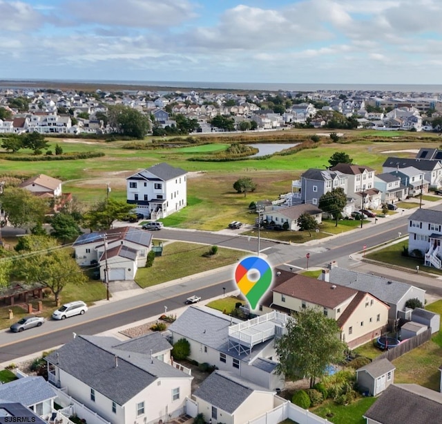 aerial view with a water view and a residential view