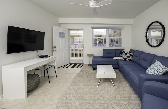 living room with ceiling fan and light tile patterned flooring