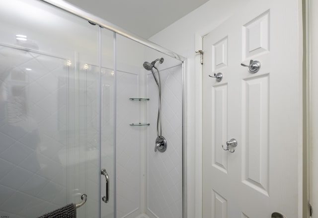 full bathroom featuring a shower stall