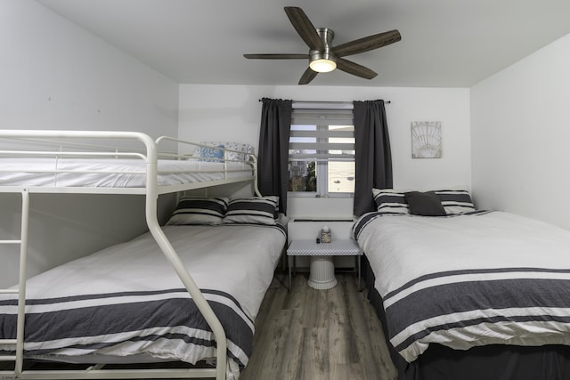 bedroom with a ceiling fan and wood finished floors