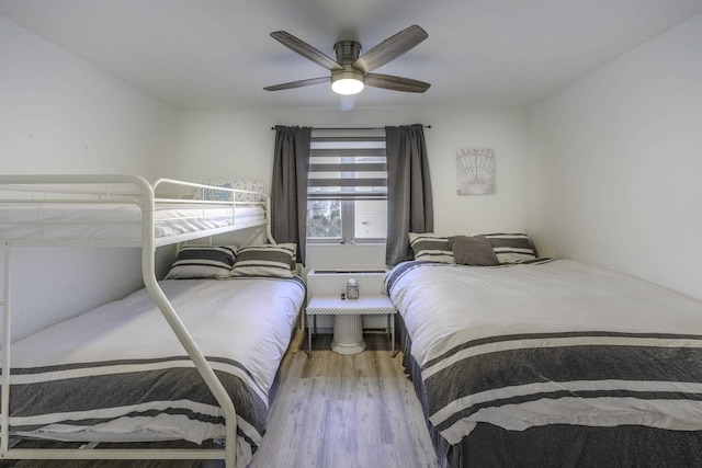 bedroom with ceiling fan and wood finished floors