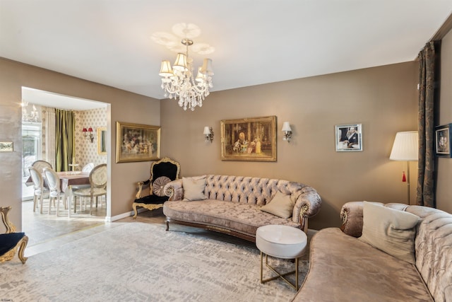 living area with a chandelier and baseboards