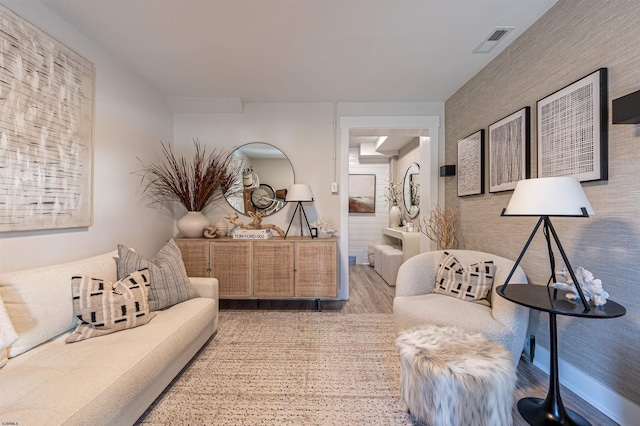 interior space with visible vents and wood finished floors