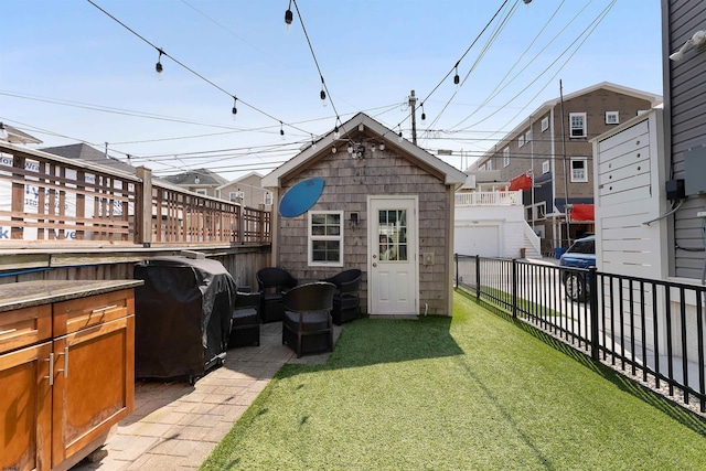 view of outbuilding with fence private yard and an outdoor structure