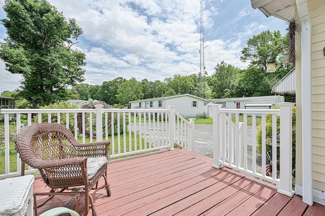 wooden deck with an outbuilding