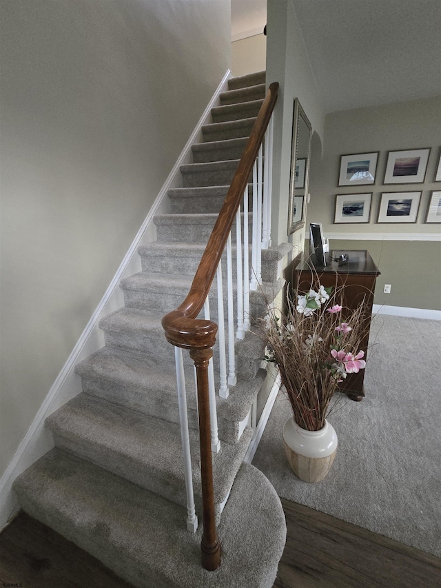 stairs featuring baseboards