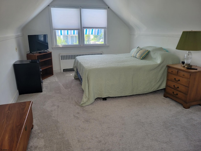 bedroom featuring carpet floors, baseboards, vaulted ceiling, and radiator heating unit