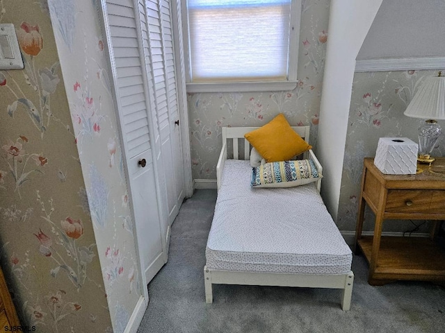 bedroom featuring wallpapered walls, baseboards, and carpet flooring