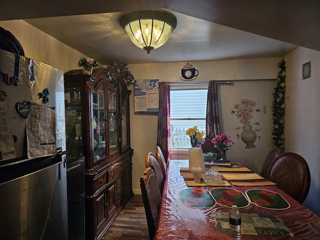 dining space featuring dark wood-type flooring