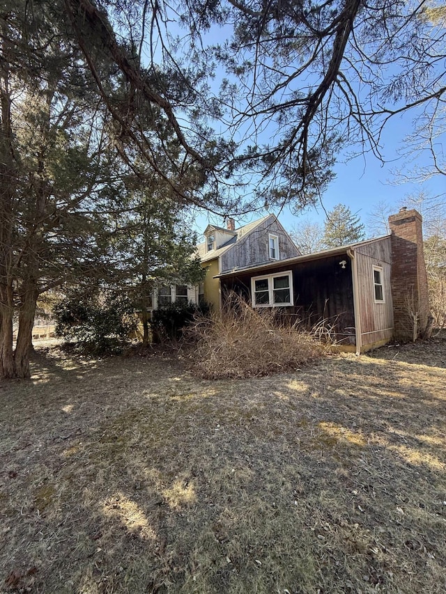 view of side of home with a chimney