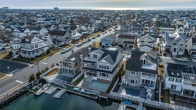 aerial view with a residential view and a water view