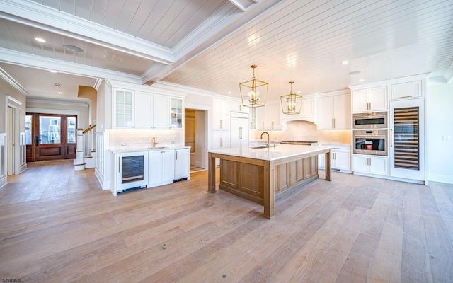 4 Grenada Ln, Ocean City, NJ 08226 - kitchen with appliances with stainless steel finishes, beverage cooler, and light countertops