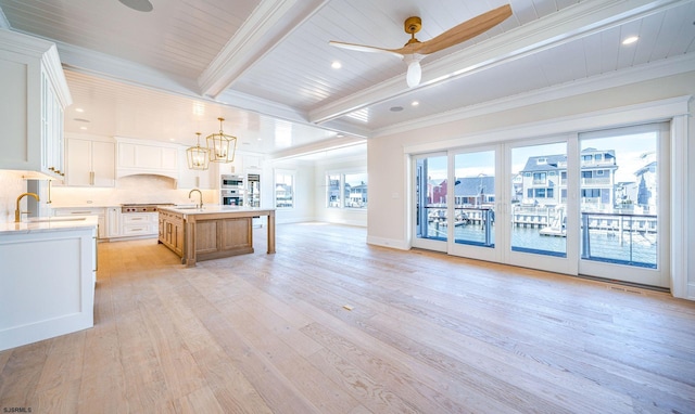 4 Grenada Ln, Ocean City, NJ 08226 - kitchen with open floor plan, light countertops, beamed ceiling, and a sink