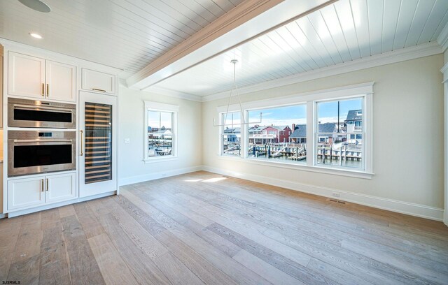 4 Grenada Ln, Ocean City, NJ 08226 - kitchen featuring wine cooler, beam ceiling, light wood finished floors, ornamental molding, and baseboards