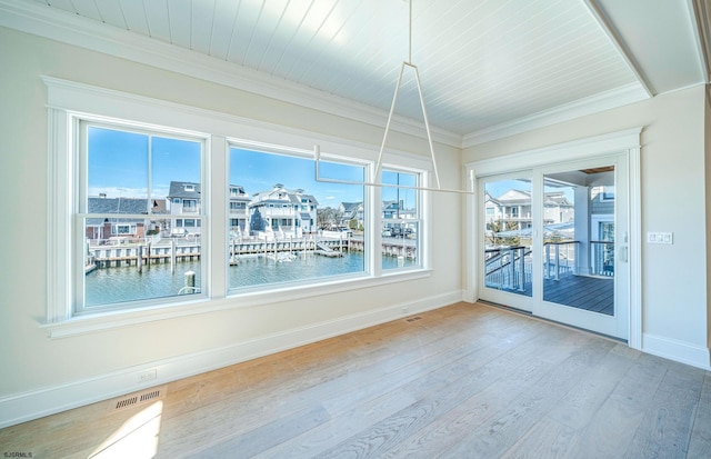 4 Grenada Ln, Ocean City, NJ 08226 - spare room featuring visible vents, baseboards, wood finished floors, a water view, and crown molding