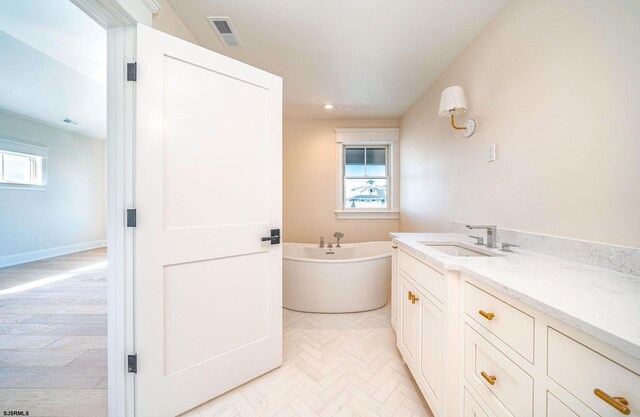 4 Grenada Ln, Ocean City, NJ 08226 - bathroom with a wealth of natural light, a freestanding tub, visible vents, and vanity