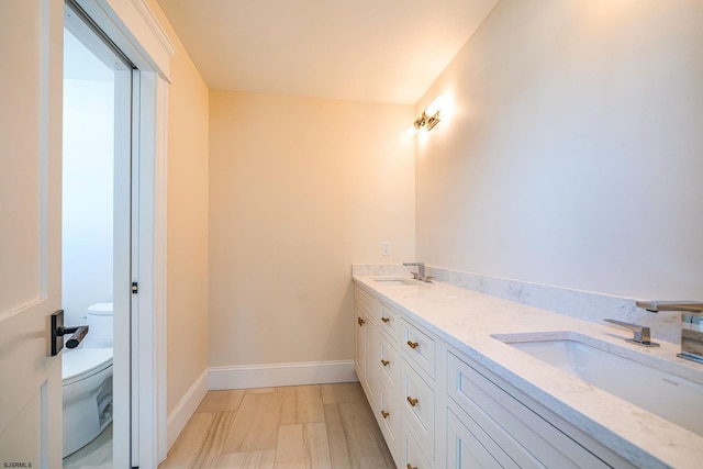 4 Grenada Ln, Ocean City, NJ 08226 - bathroom with double vanity, a sink, toilet, and baseboards