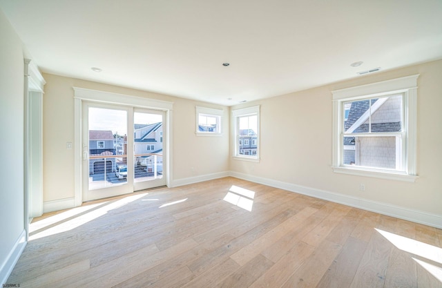 4 Grenada Ln, Ocean City, NJ 08226 - spare room with a healthy amount of sunlight, visible vents, baseboards, and light wood finished floors