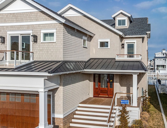 4 Grenada Ln, Ocean City, NJ 08226 - view of front of home with roof with shingles, a standing seam roof, metal roof, a balcony, and fence