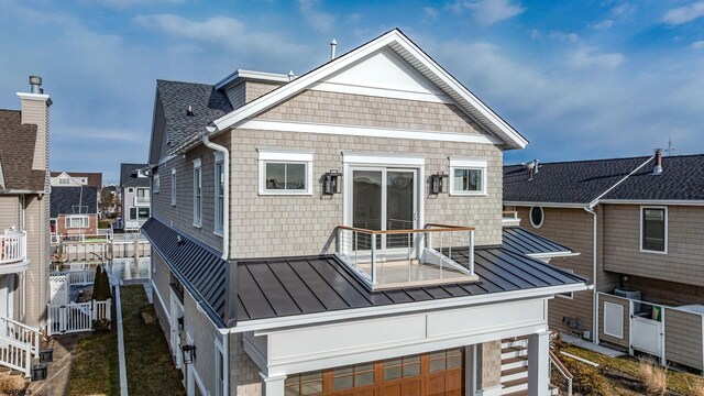 4 Grenada Ln, Ocean City, NJ 08226 - back of property with a shingled roof, a balcony, metal roof, a standing seam roof, and central AC