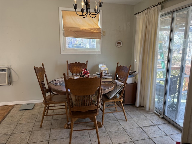 dining room with a notable chandelier, baseboards, and light tile patterned floors