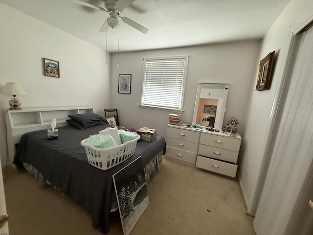 bedroom featuring light carpet and ceiling fan