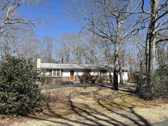 ranch-style house with a chimney