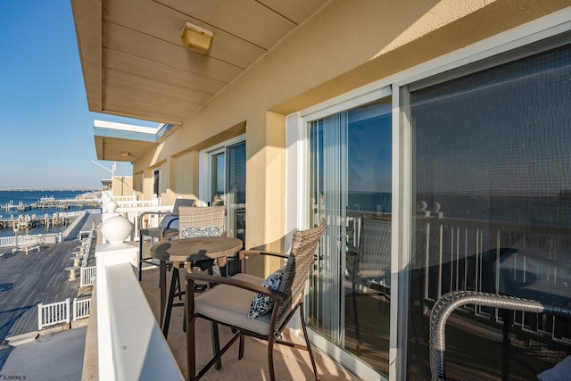 balcony featuring a water view