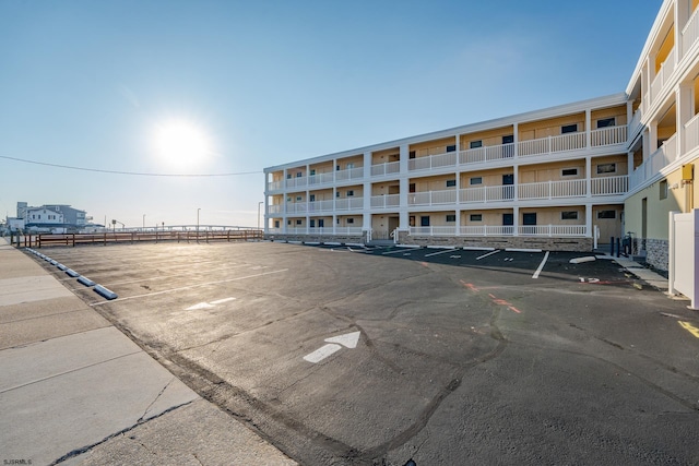 view of building exterior featuring uncovered parking