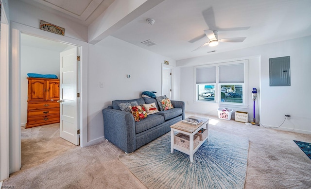 living area featuring visible vents, light carpet, ceiling fan, electric panel, and baseboards