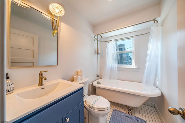 full bathroom featuring baseboards, toilet, shower / tub combo with curtain, tile patterned floors, and vanity