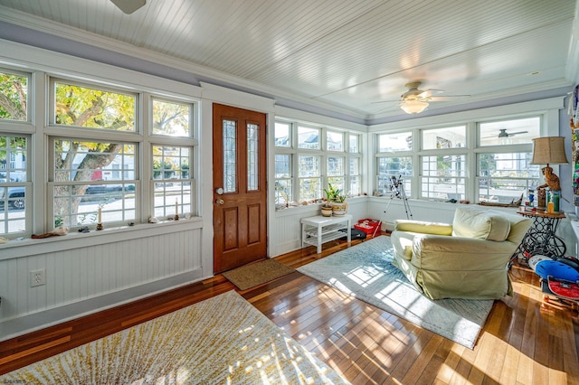 sunroom / solarium featuring ceiling fan