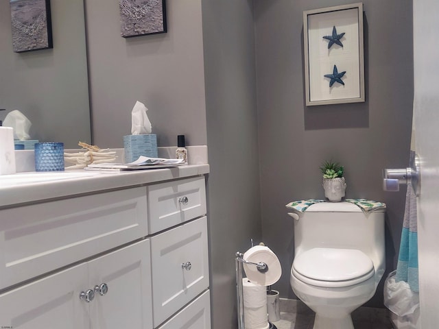 bathroom with toilet and vanity