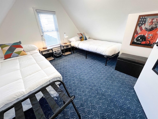 carpeted bedroom with vaulted ceiling