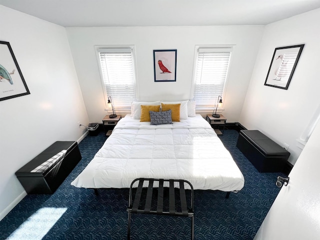 carpeted bedroom featuring baseboards