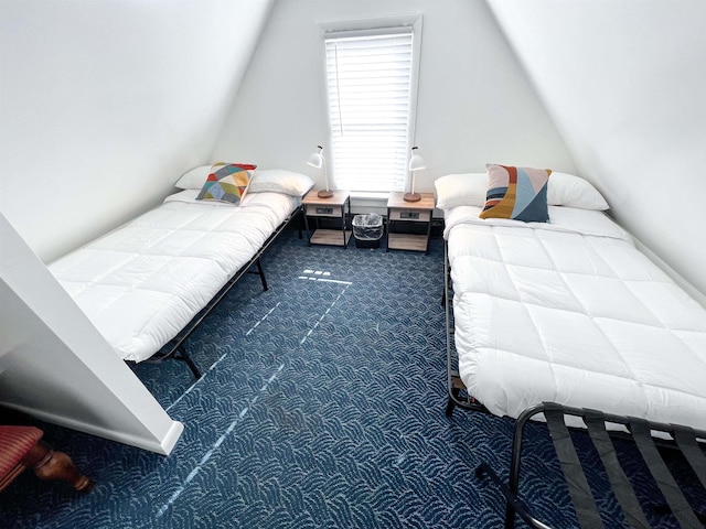 bedroom with carpet and vaulted ceiling