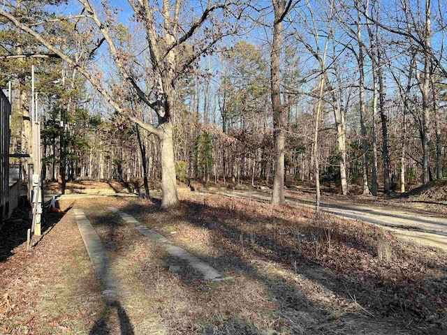 view of street featuring a forest view