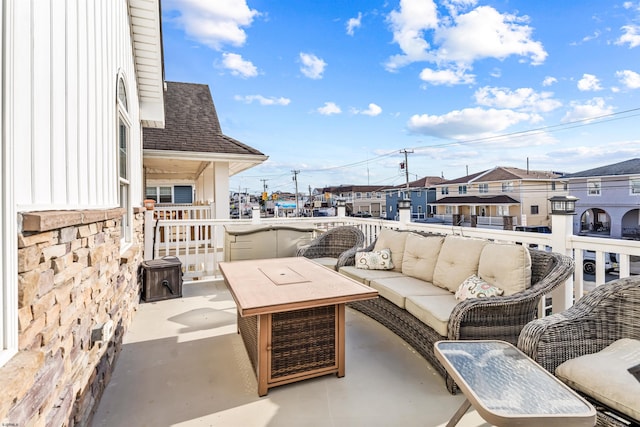 view of patio with a residential view and an outdoor living space