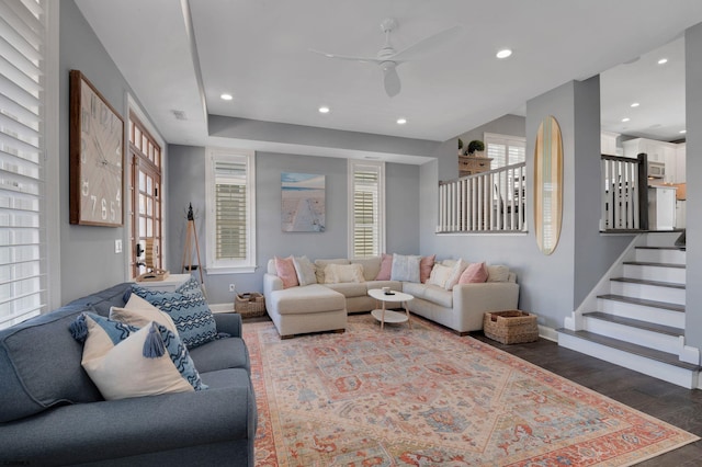 living area with baseboards, a ceiling fan, stairway, wood finished floors, and recessed lighting