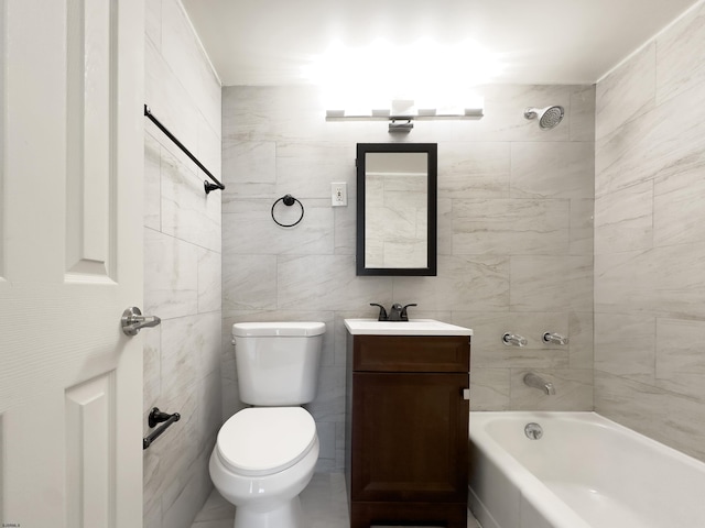 bathroom featuring tub / shower combination, vanity, and toilet