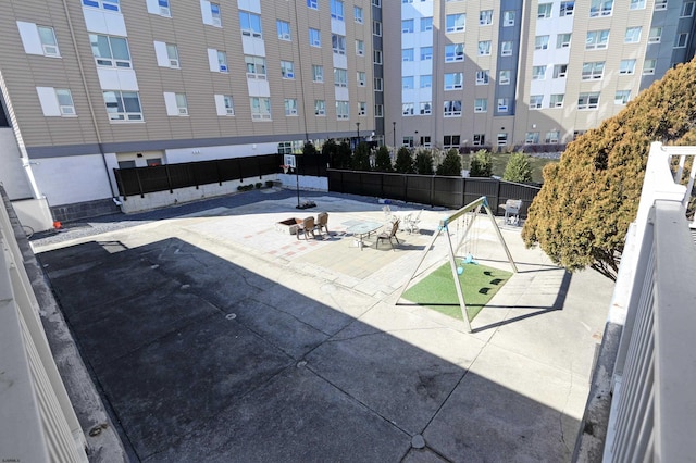 view of swimming pool with fence